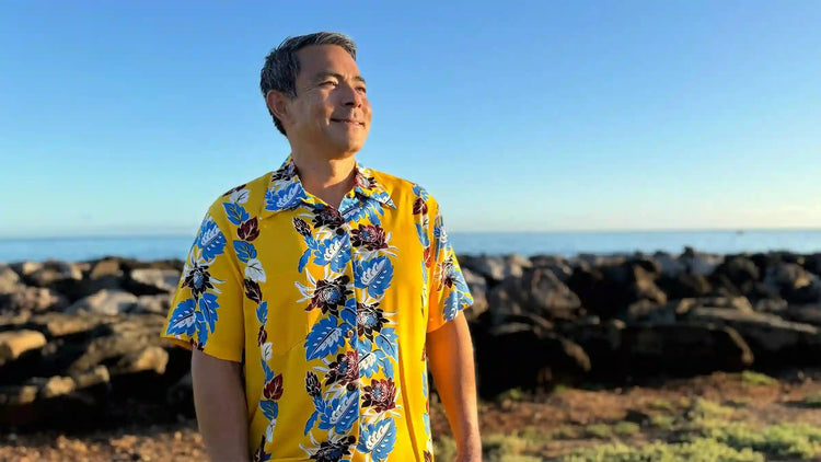 A middle-aged man with a vintage Hawaiian shirt