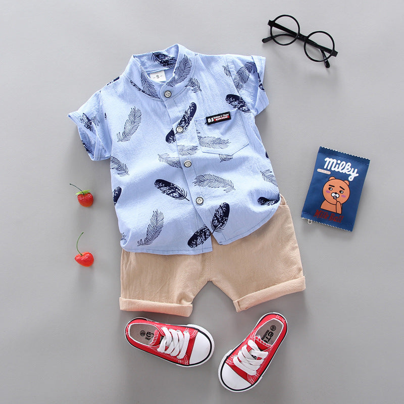 Two-piece outfit for kids featuring a T-shirt with a colorful cartoon feather print and coordinating shorts
