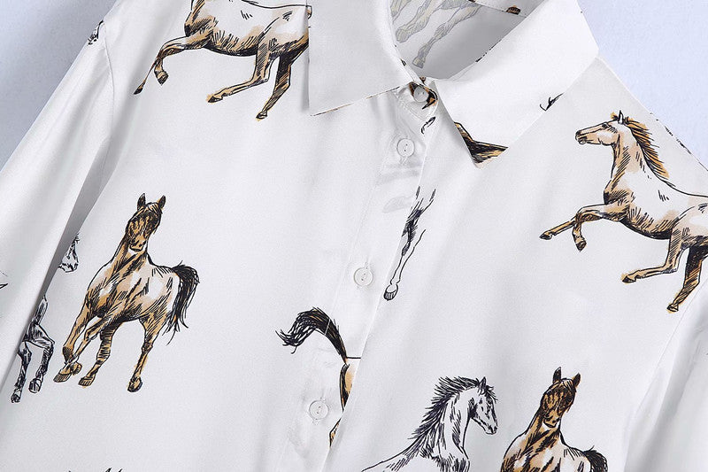 Breezy beach days with horses: Loose-fit horse print shirt for effortless style on the shore.