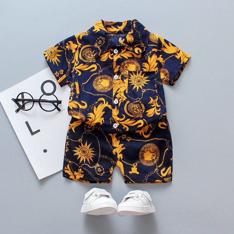 Two-piece summer outfit for children featuring a shirt with a floral design and coordinating shorts.    tune  share   more_vert