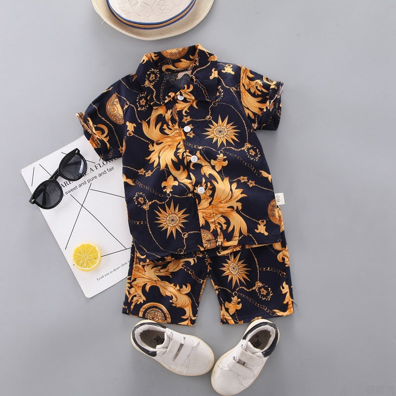 Two-piece summer outfit for a baby boy featuring a shirt with a floral design and coordinating shorts.