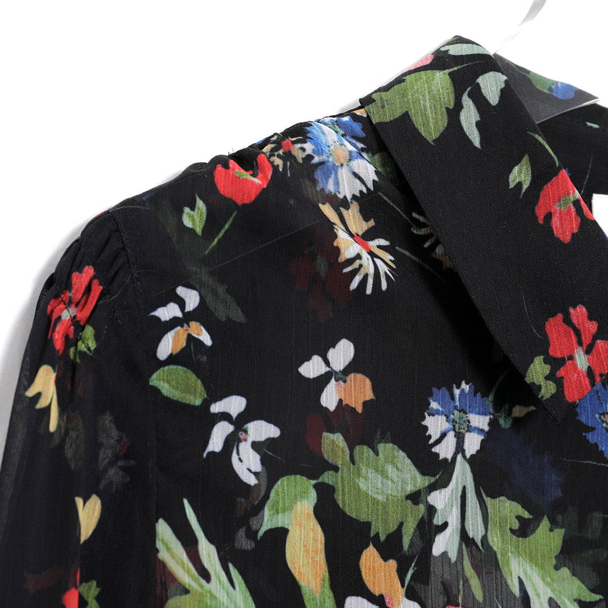 Beach brights with a floral touch: Unleash a burst of color with this floral print beach shirt.