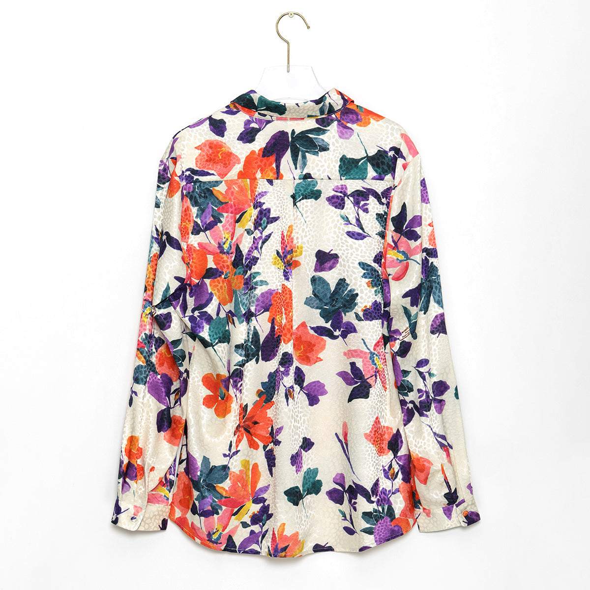 Beachy chic, even when it's cool: woman styles a long sleeve floral Hawaiian shirt.
