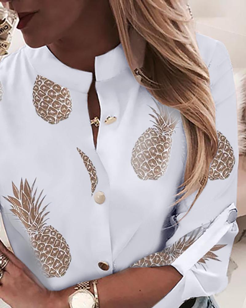Island chic with a wink: Playful pineapple print elevates this women's Hawaiian shirt.