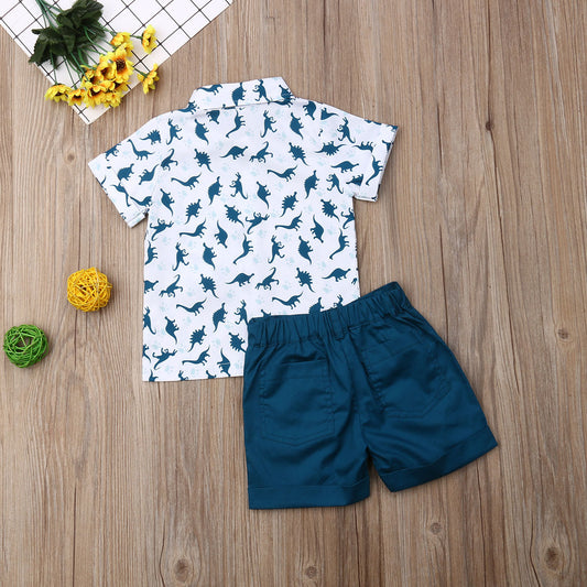 Two-piece outfit for boys featuring a shirt with a dinosaur design and coordinating pants.    tune  share   more_vert