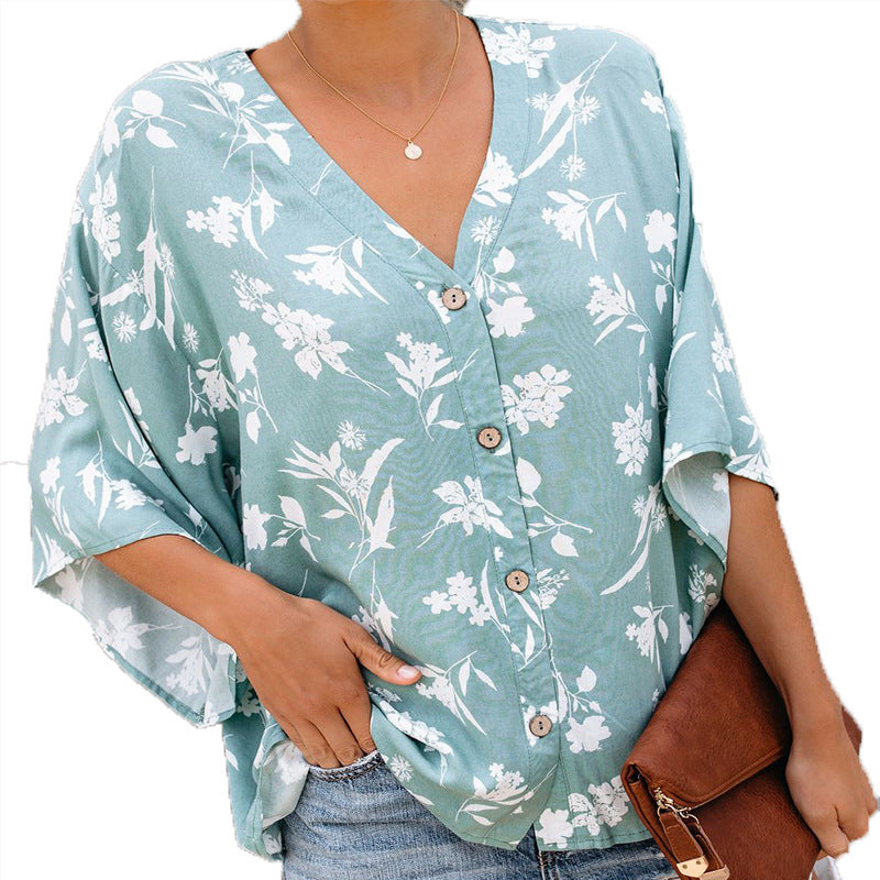 Island chic in chiffon: Flowy printed Hawaiian shirt elevates your summer beach style.
