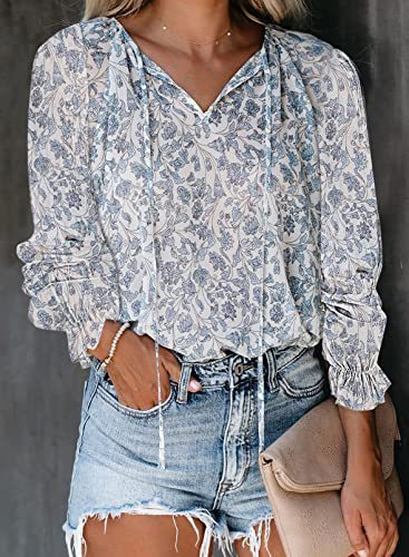 Island warmth with a twist: Woman in a long-sleeved floral Hawaiian shirt with a V-neck.