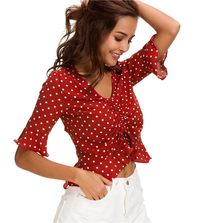 Embrace the beach with playful dots: Polka dots bring a touch of cheer to this breezy Hawaiian shirt.