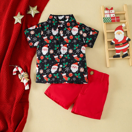 Boy wearing a short-sleeved shirt with a festive Christmas print