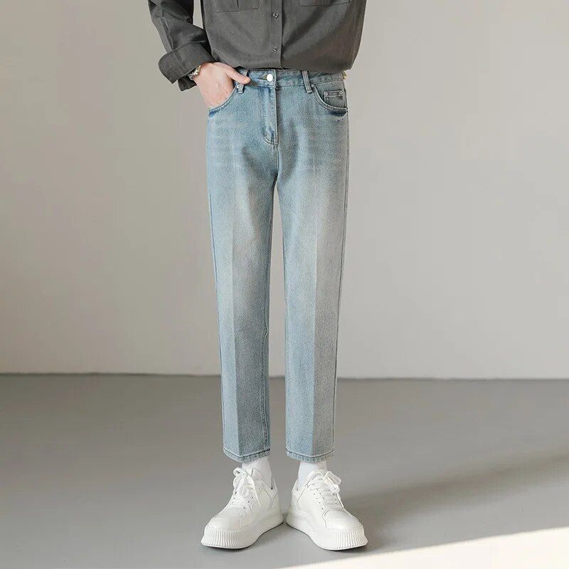 Stylish men's slim fit stretch denim jeans in light blue, with ankle-length cut for casual comfort