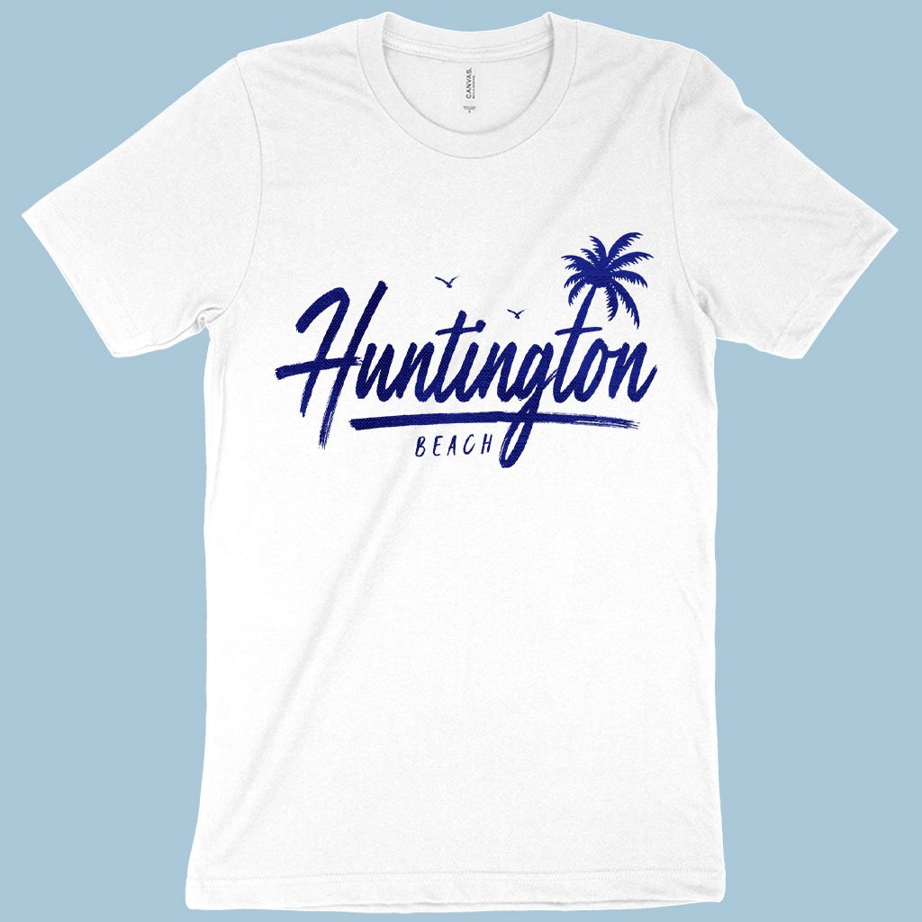 A white-colored T-shirt with blue prints of Huntington Beach, California.