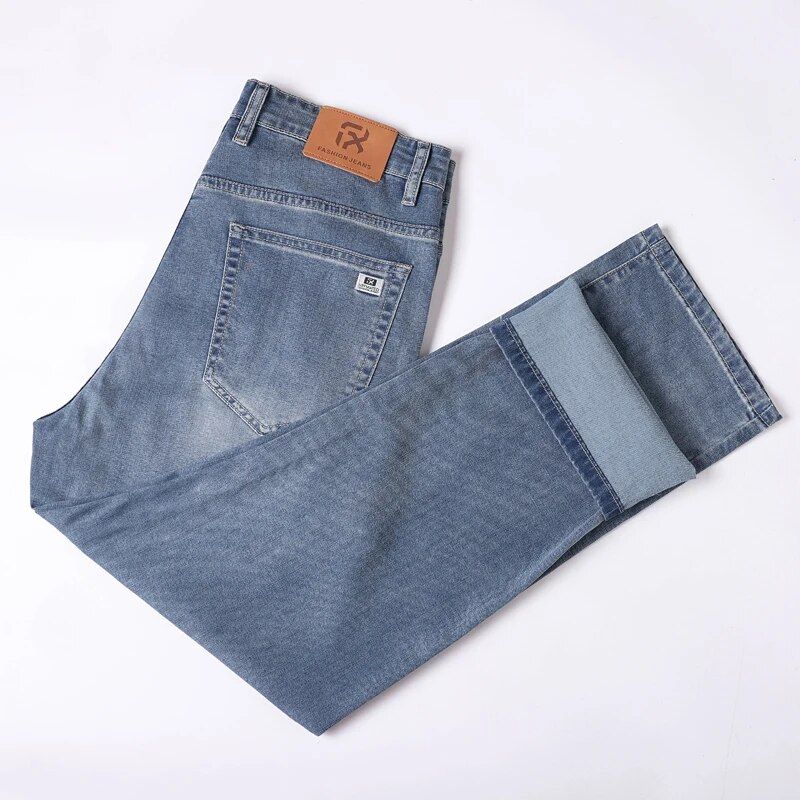 Casual men's jeans in a refreshing light blue shade, great for warm weather.
