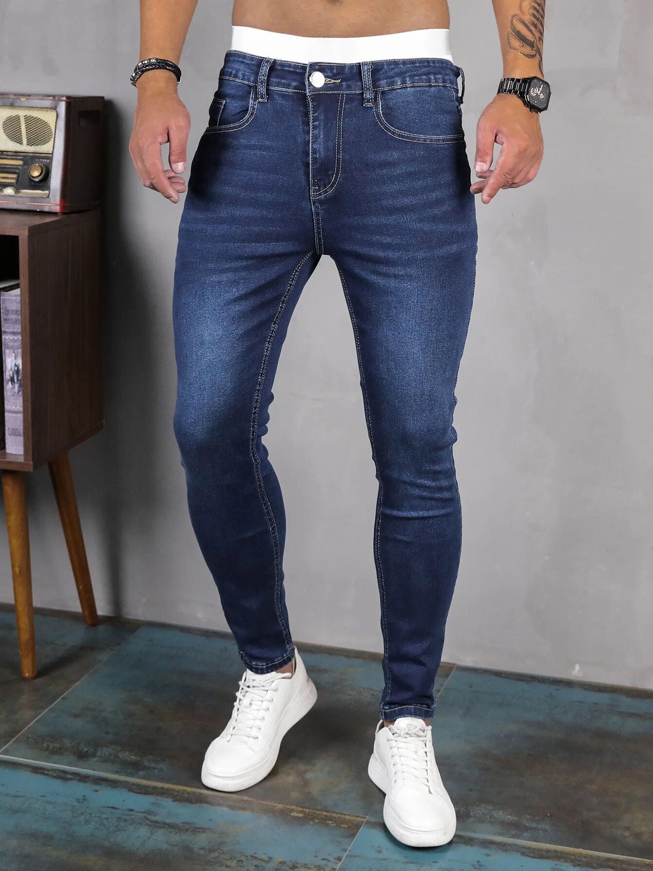 Blue color men's jeans, styled casually with a slim fit and pockets