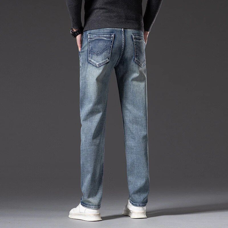 Men's straight fit stretch jeans with vintage flair, crafted from cotton