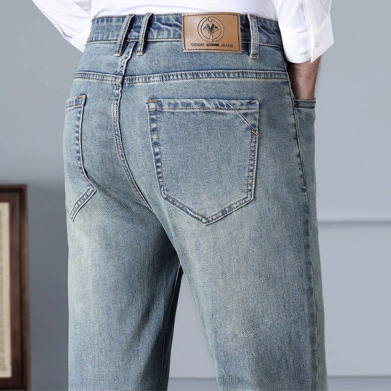 Men's jeans designed for casual comfort in autumn, featuring a high waist and elastic cotton blend