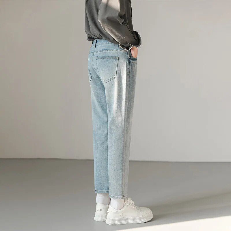 Casual light blue men's slim fit stretch denim jeans with ankle-length design