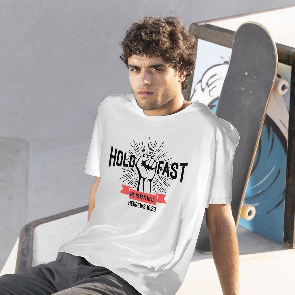 A young American is wearing a "Hold Fast, He is Faithful" Christian t-shirt