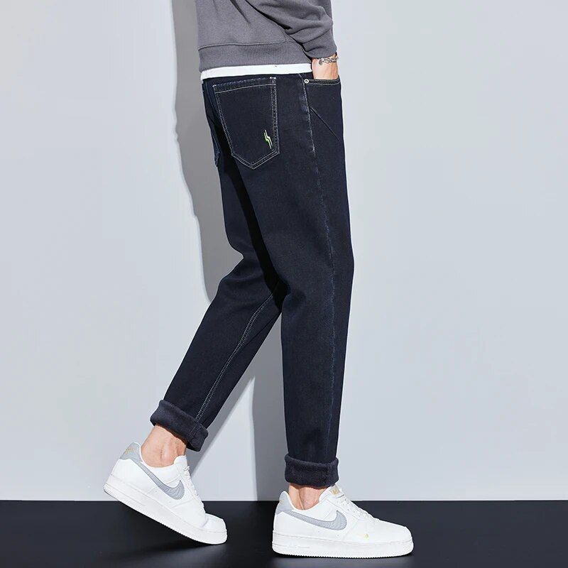 Men's stylish winter fleece-lined slim fit jeans, offering warmth, style, and casual comfort.