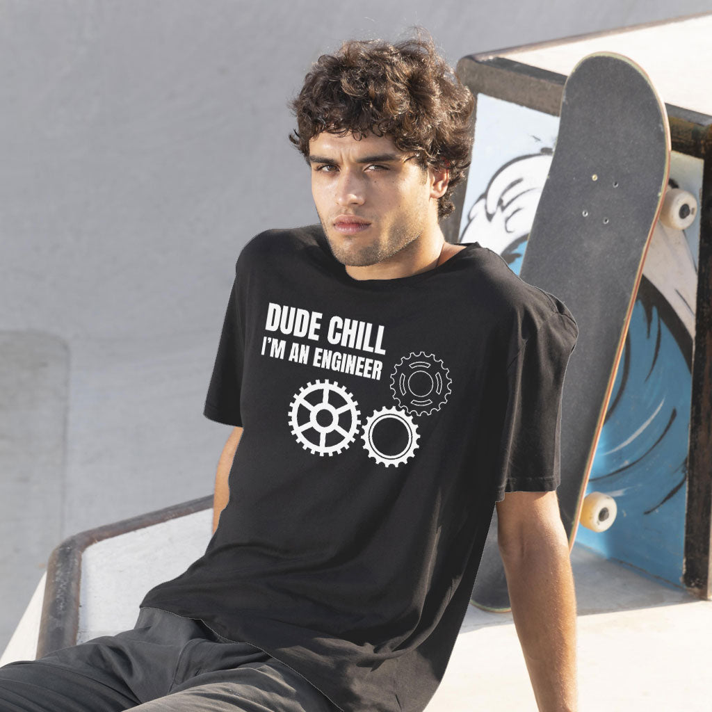 A young model from the USA wears our product dude chill I am an Engineer t shirt- funny engineer t-shirts