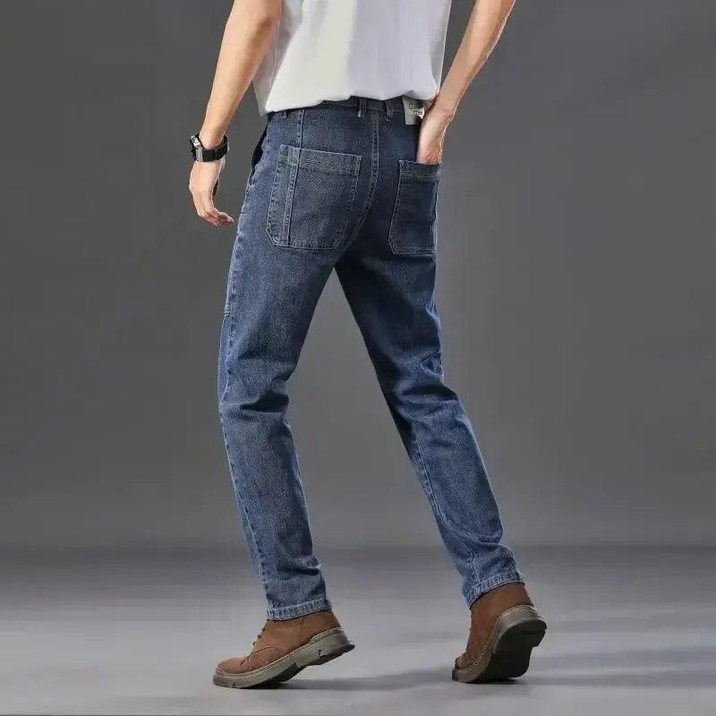 Trendy six-pocket cargo jeans for men, designed as slim fit work pants.